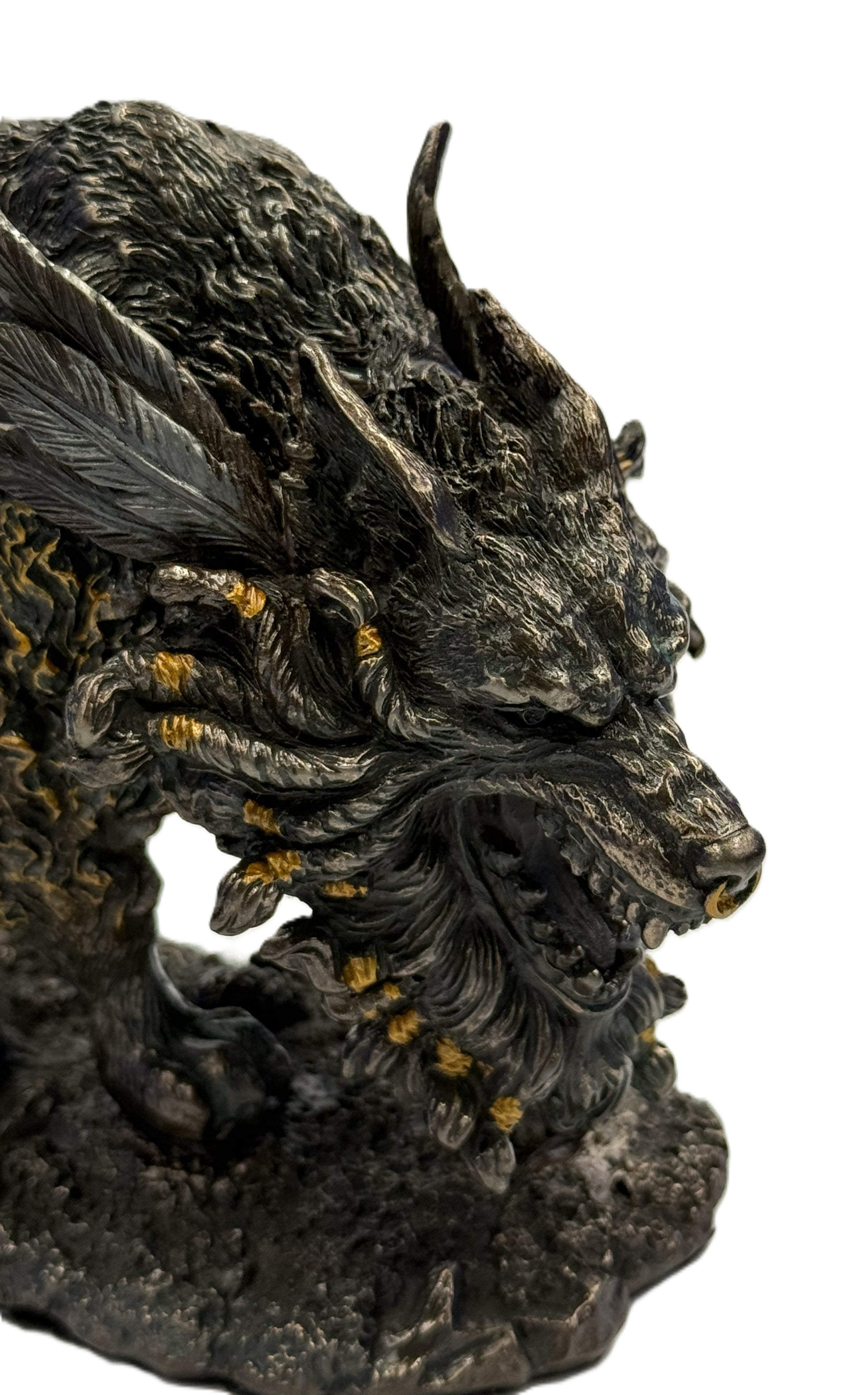 Close up of Fenrir wolf head with horns, sharp teeth, and bronze accented details
