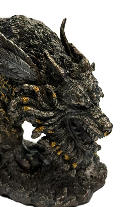 Close up of Fenrir wolf head with horns, sharp teeth, and bronze accented details
