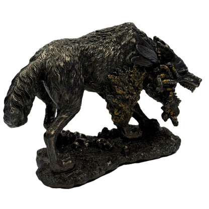 Side view of Norse wolf statue emphasizing movement and sculpted base details
