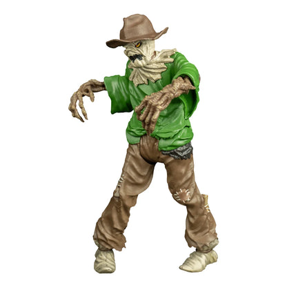 Angled view of Goosebumps Scarecrow action figure showing its skeletal hands, tattered clothing and brown hat.