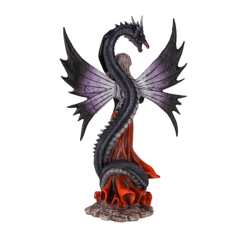 Back view of fairy and dragon statue showing wings and coiled dragon detail
