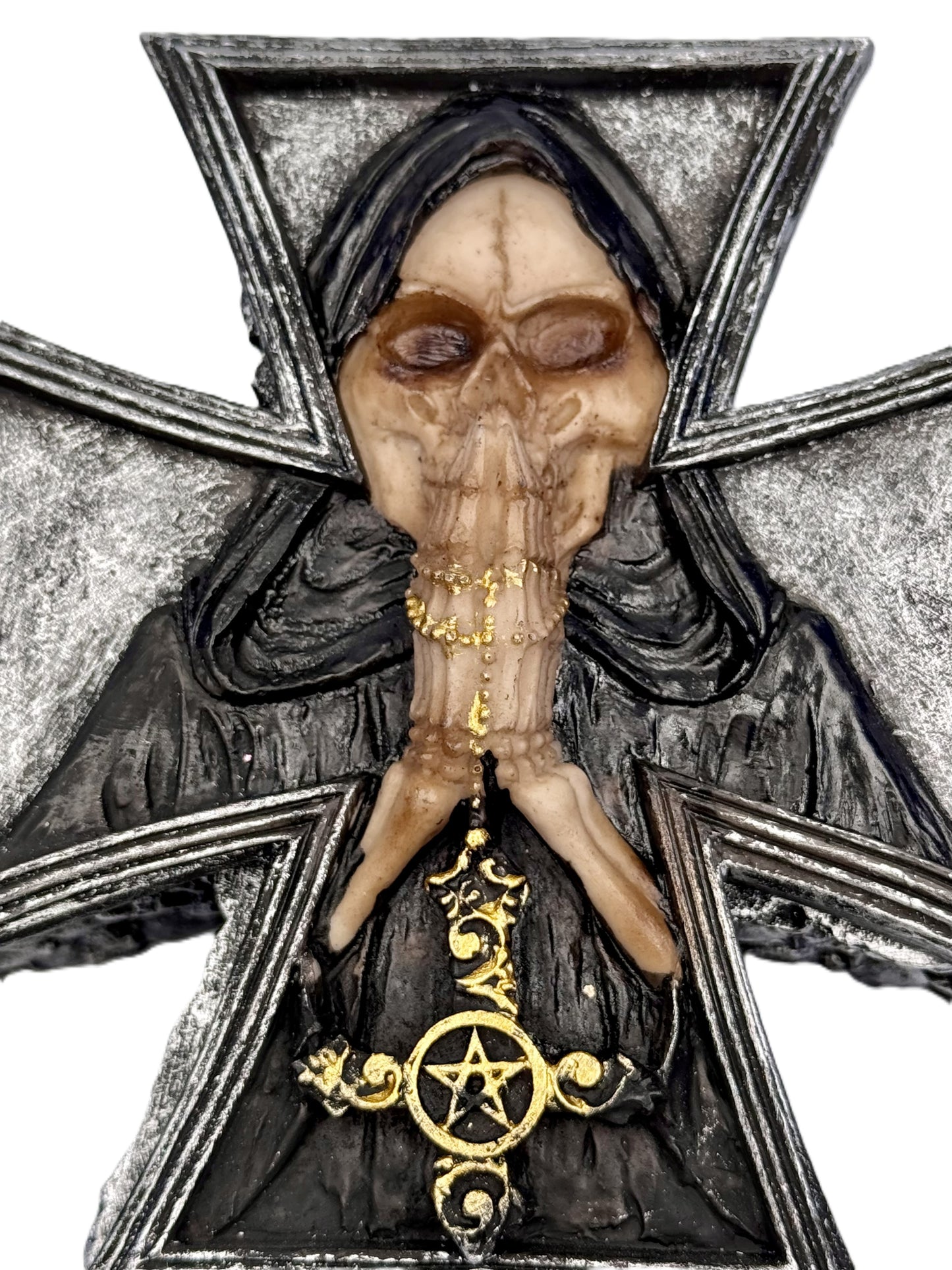 Close-up of grim reaper skull and gold cross centerpiece
