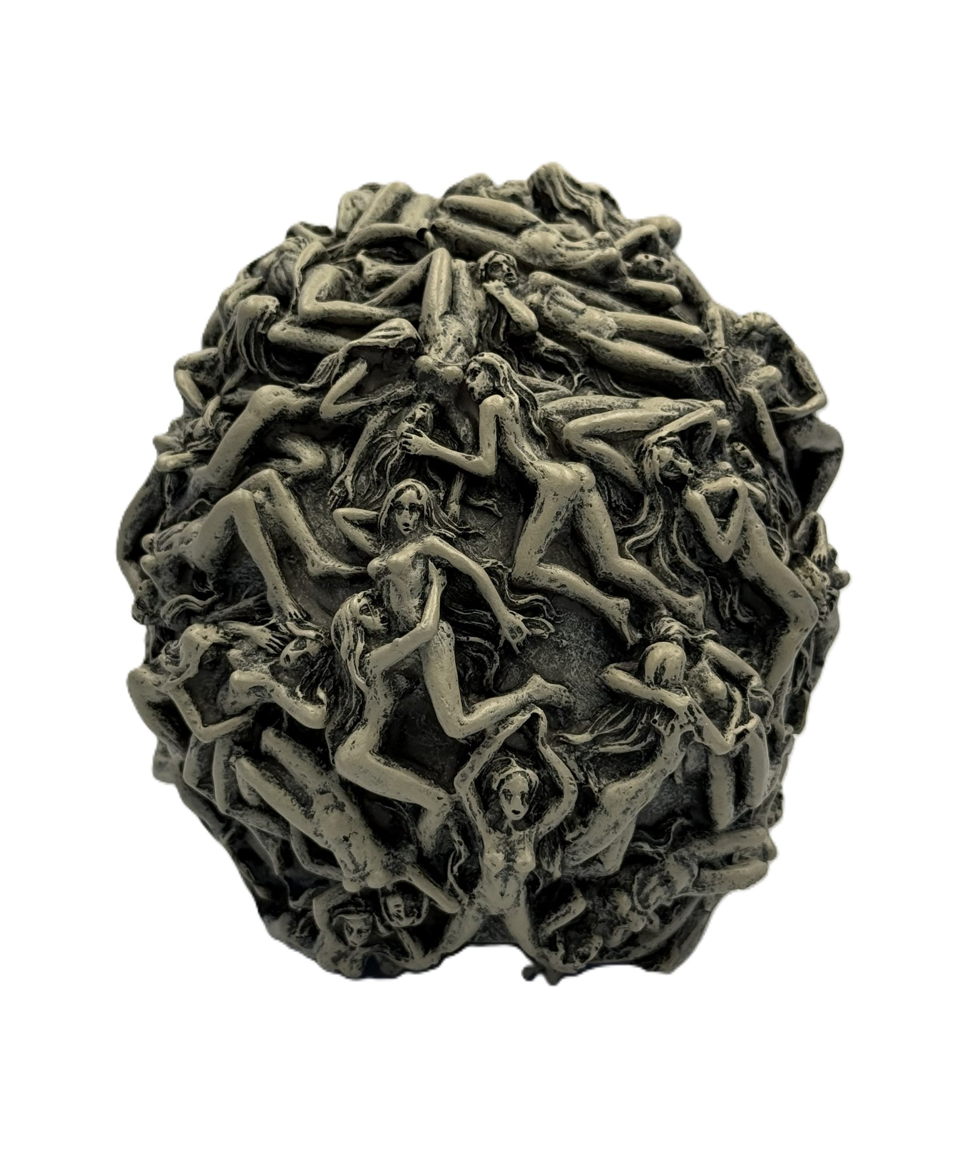 Back view of skull statue showing dense arrangement of intertwined figures covering the entire surface
