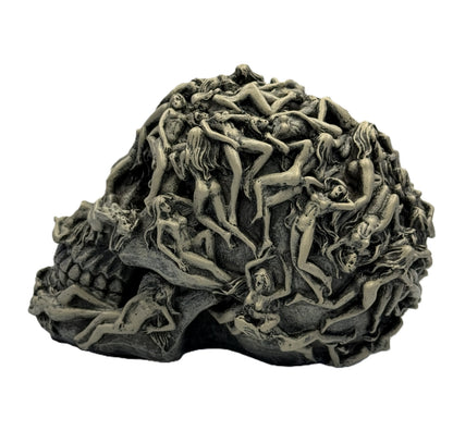 Right side view of gothic skull figurine highlighting sculpted figures and texture detail
