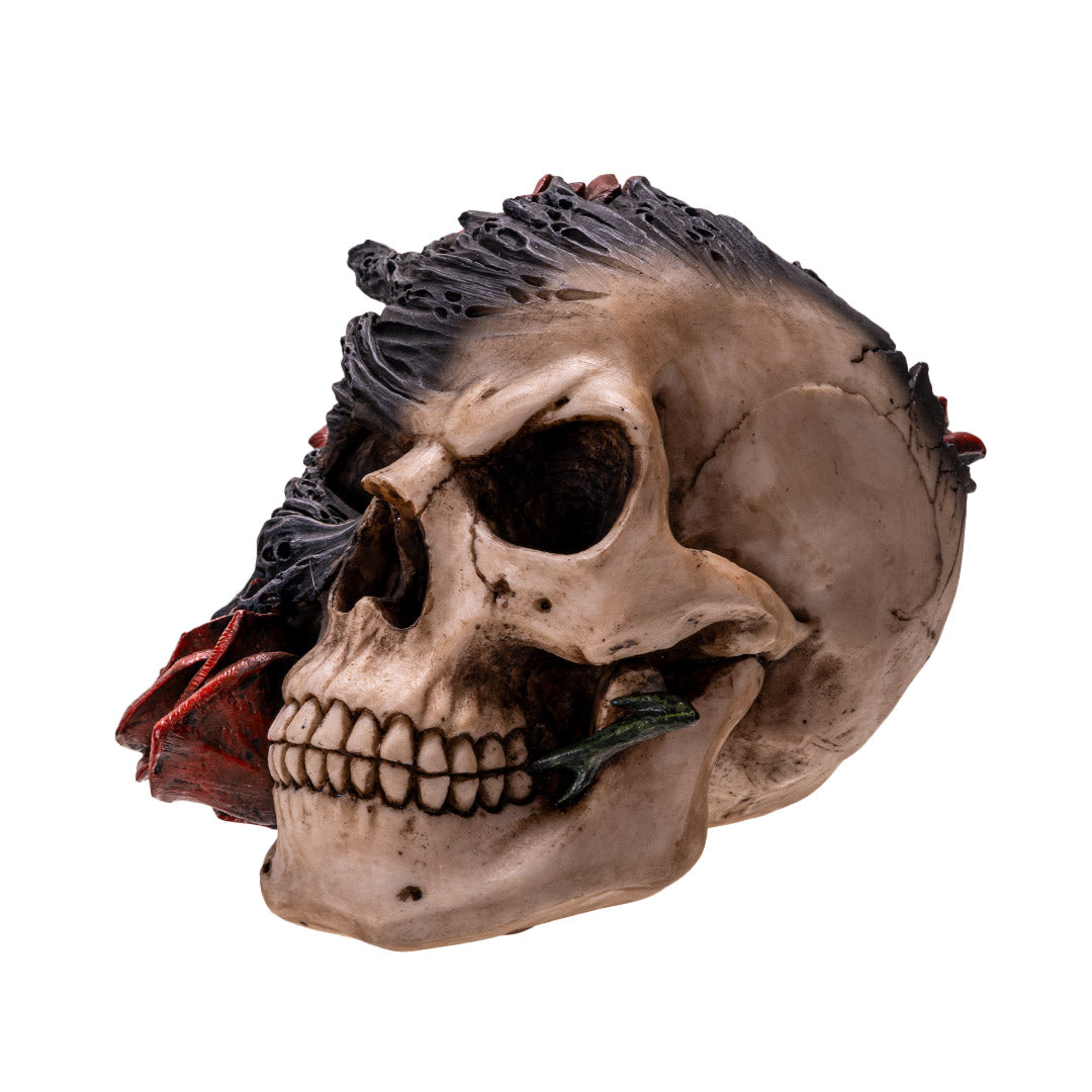 Right angle view of skull sculpture with rose and flame detail
