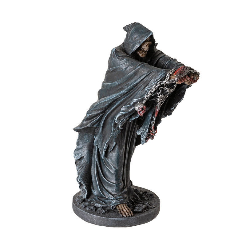 Side view of gothic grim reaper statue highlighting pose and chain details
