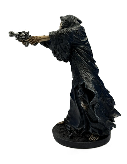Left side view of western grim reaper figure aiming revolver showing tattered cloak texture and skeletal arm detail
