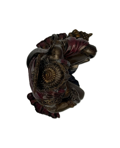 Top view of Hanuman statue showing full composition including mace, garments, and sculpted details
