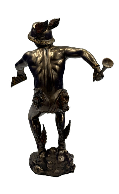 Back view of Hermes statue showing detailed musculature, wings, and flowing drapery
