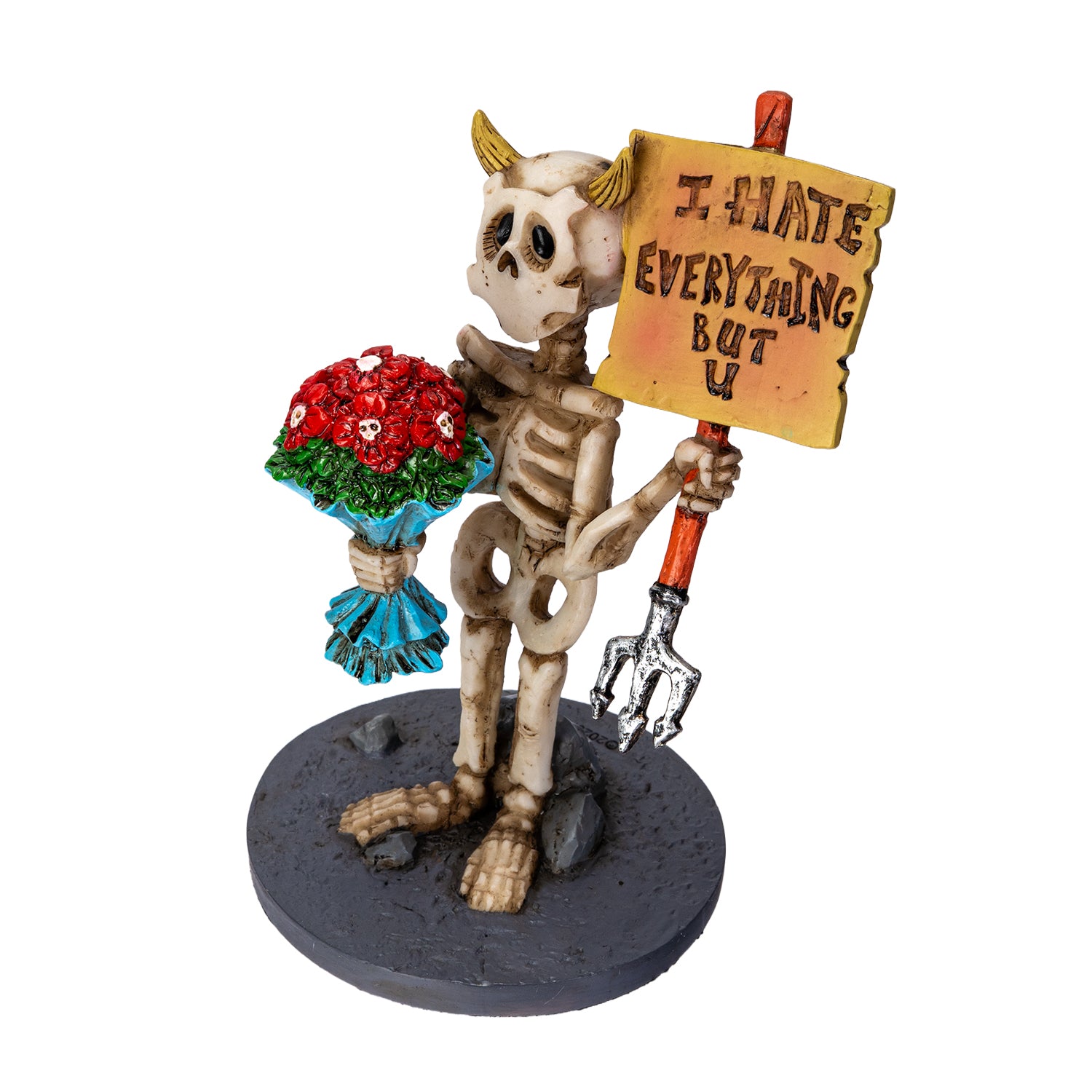 Left angle view of gothic skeleton figurine with flowers and sign
