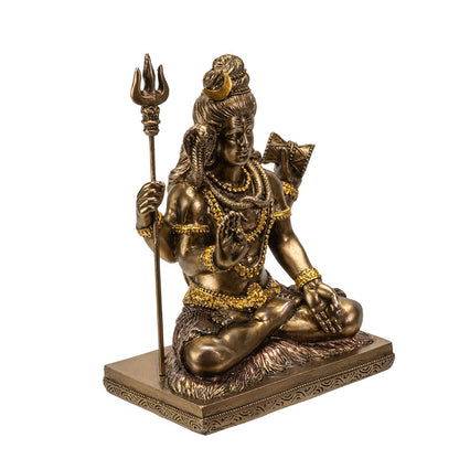 Angled view of Shiva statue highlighting trident and intricate craftsmanship
