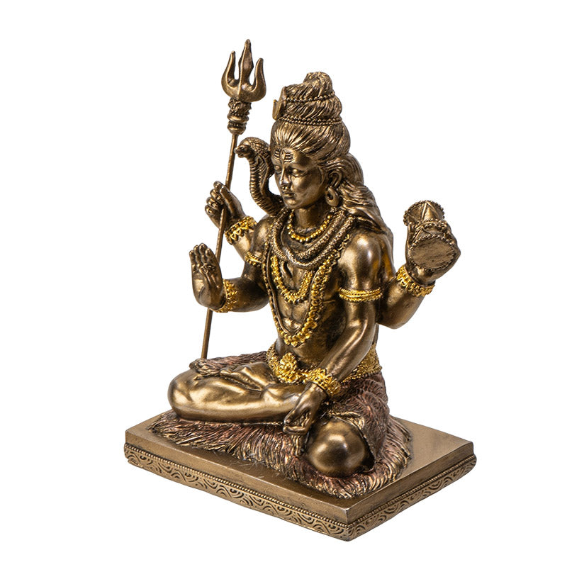 Side view of Lord Shiva statue showing seated posture and symbolic details
