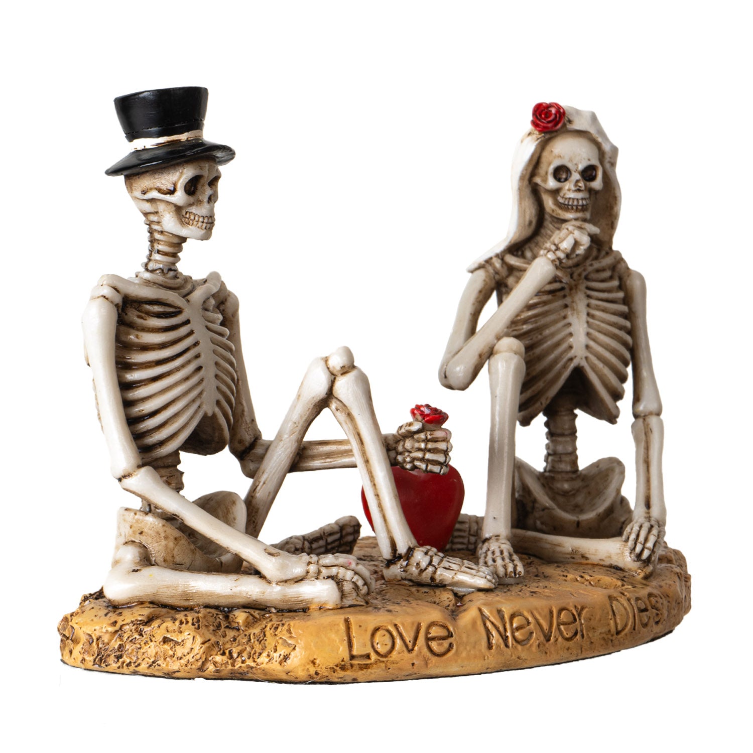 Angled view of gothic skeleton couple figurine highlighting heart and engraved base

