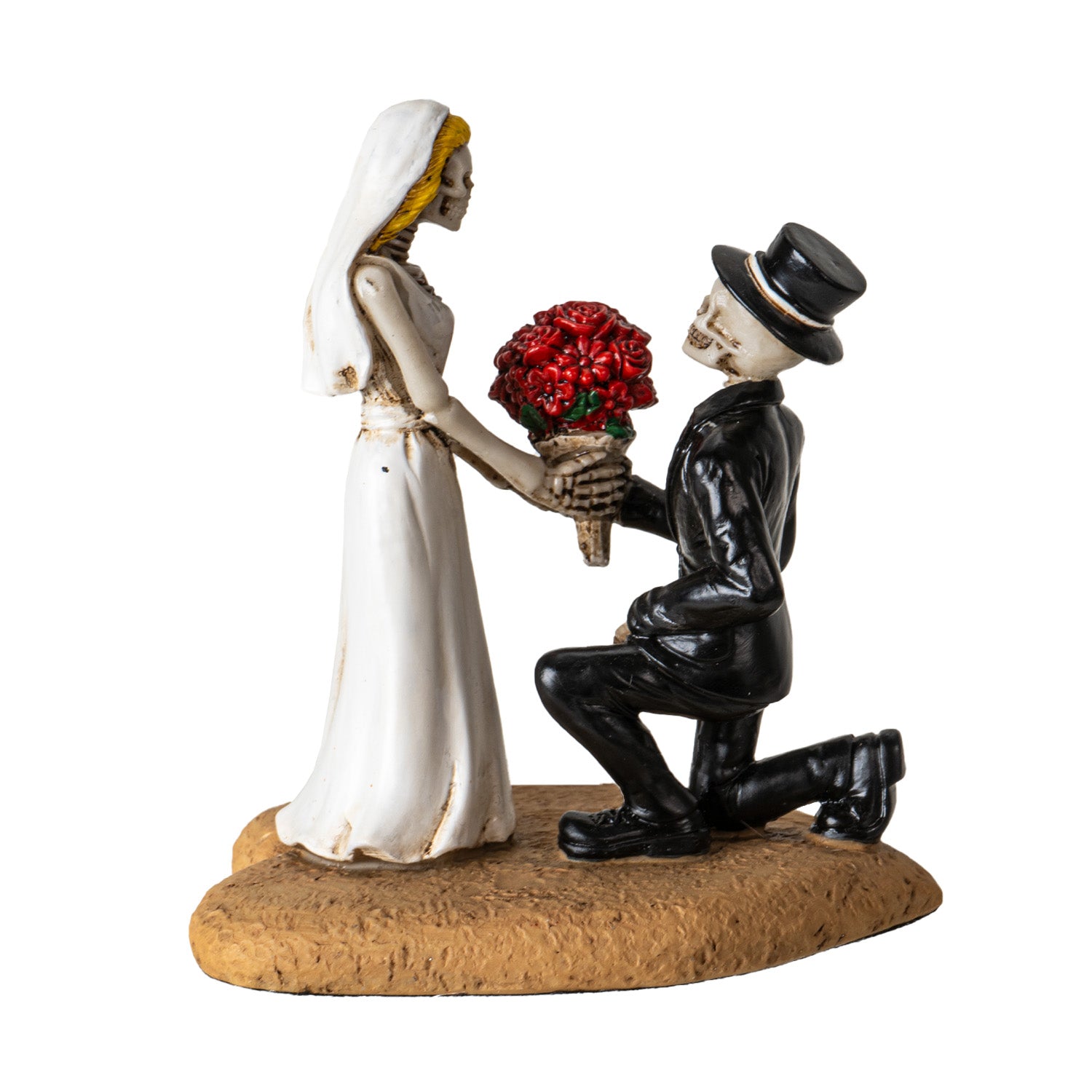 Side view of gothic skeleton wedding couple statue showing bride dress and groom kneeling
