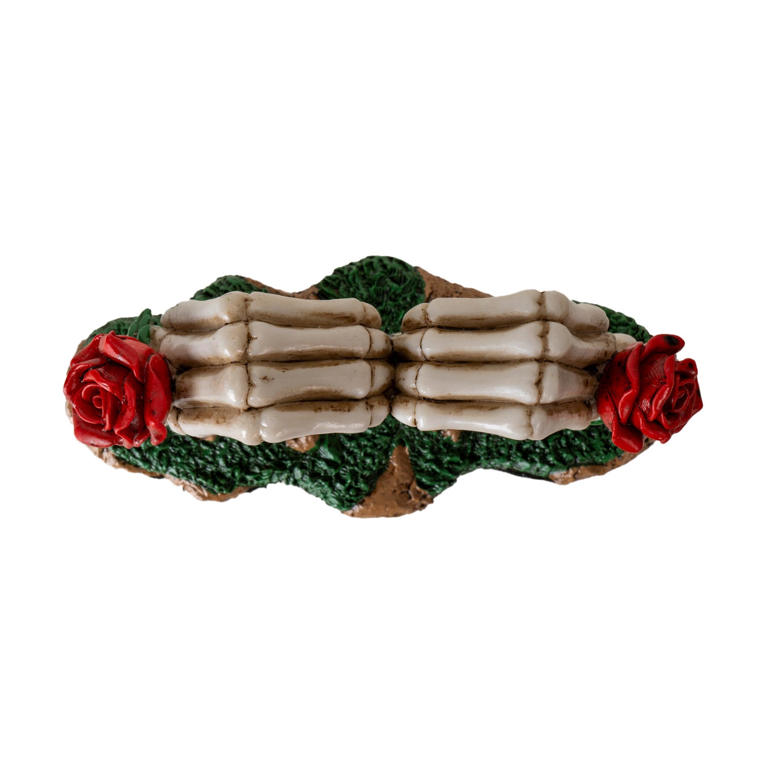 Top view of skeleton hands forming heart shape with red roses on each side

