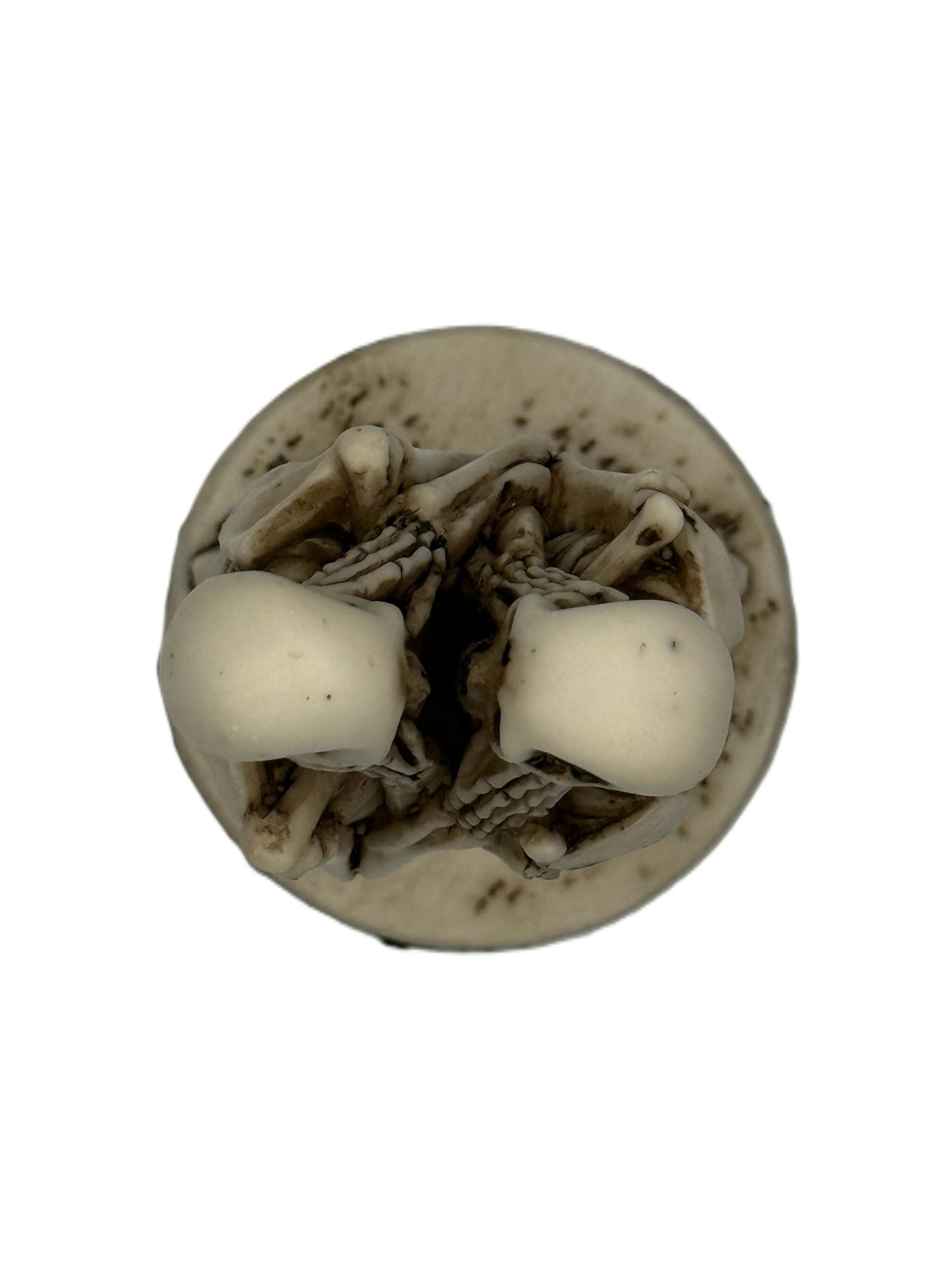 Top view of skeleton couple statue showing close embrace and detailed sculpt from above
