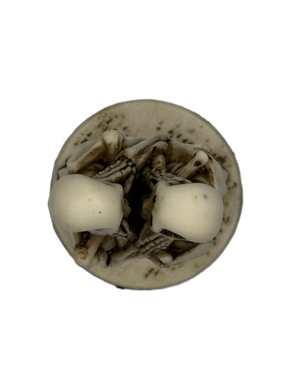 Top view of skeleton couple statue showing close embrace and detailed sculpt from above
