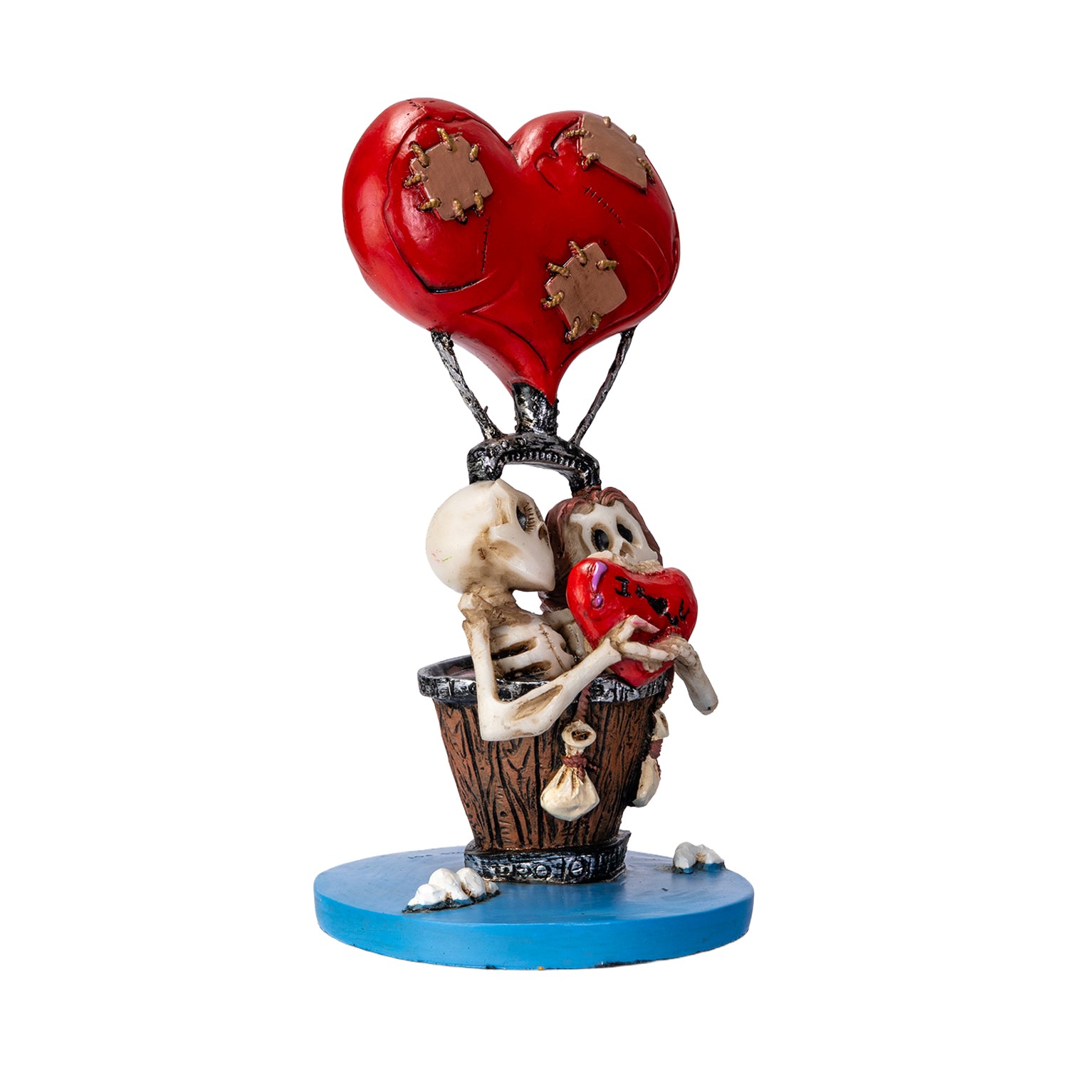 Right angle view of skeleton couple figurine with romantic gothic design

