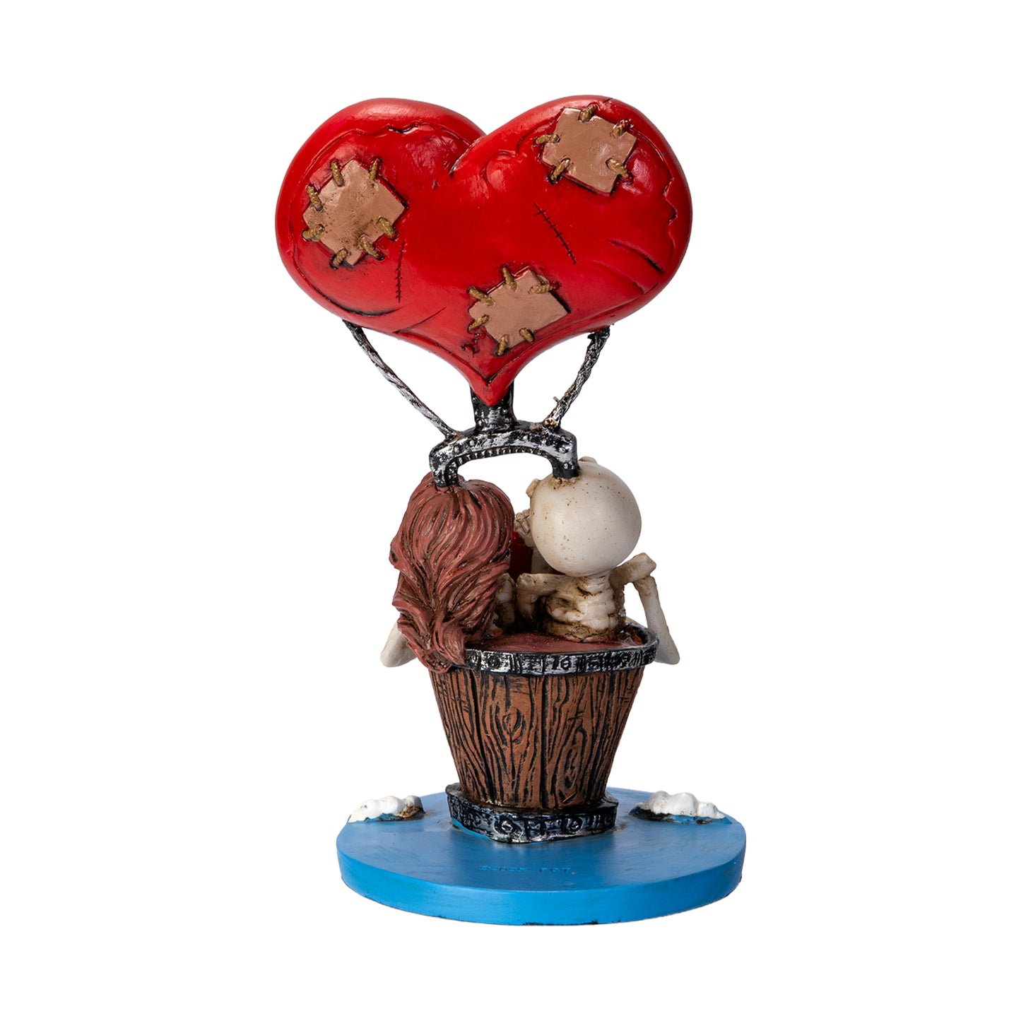 Back view of skeleton couple figurine showing balloon and detailed sculpting
