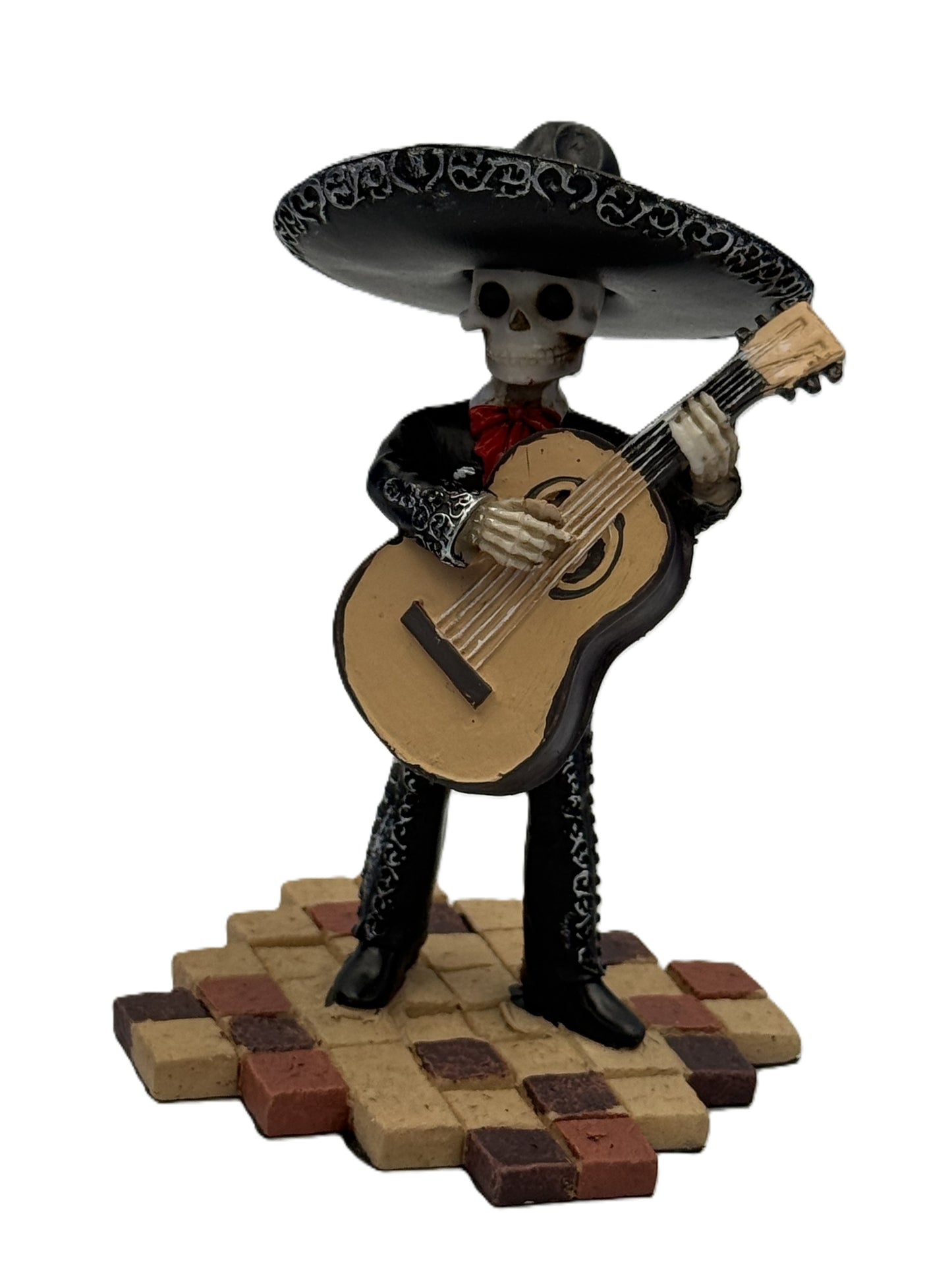 Front view of Day of the Dead mariachi skeleton figurine playing bass guitar in black outfit with sombrero resin statue

