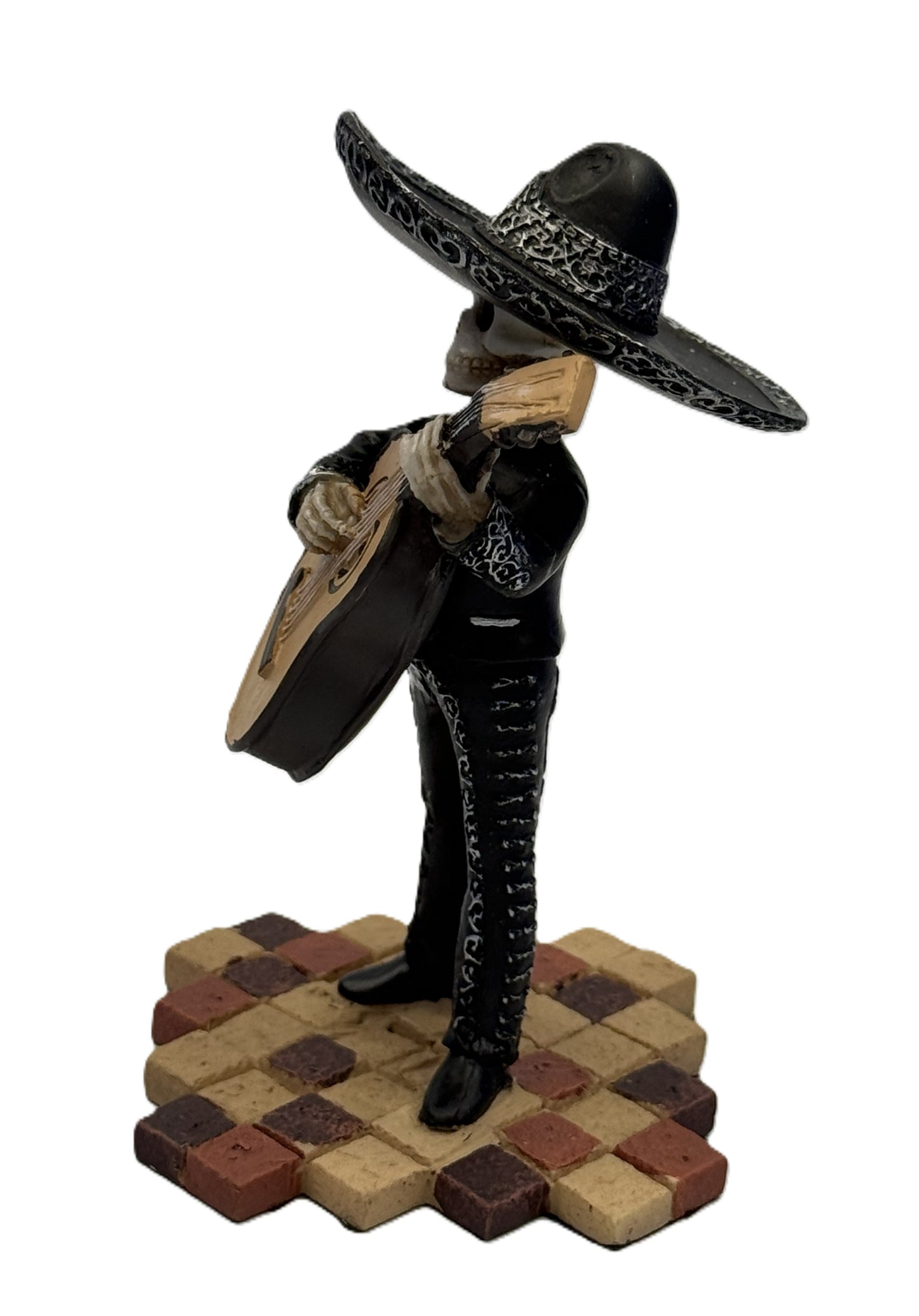 Side view of skeleton mariachi bass guitarist figurine with detailed black outfit and sombrero resin statue
