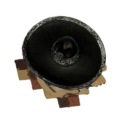 Top view of mariachi skeleton bass guitar figurine showing sombrero and tiled base resin statue
