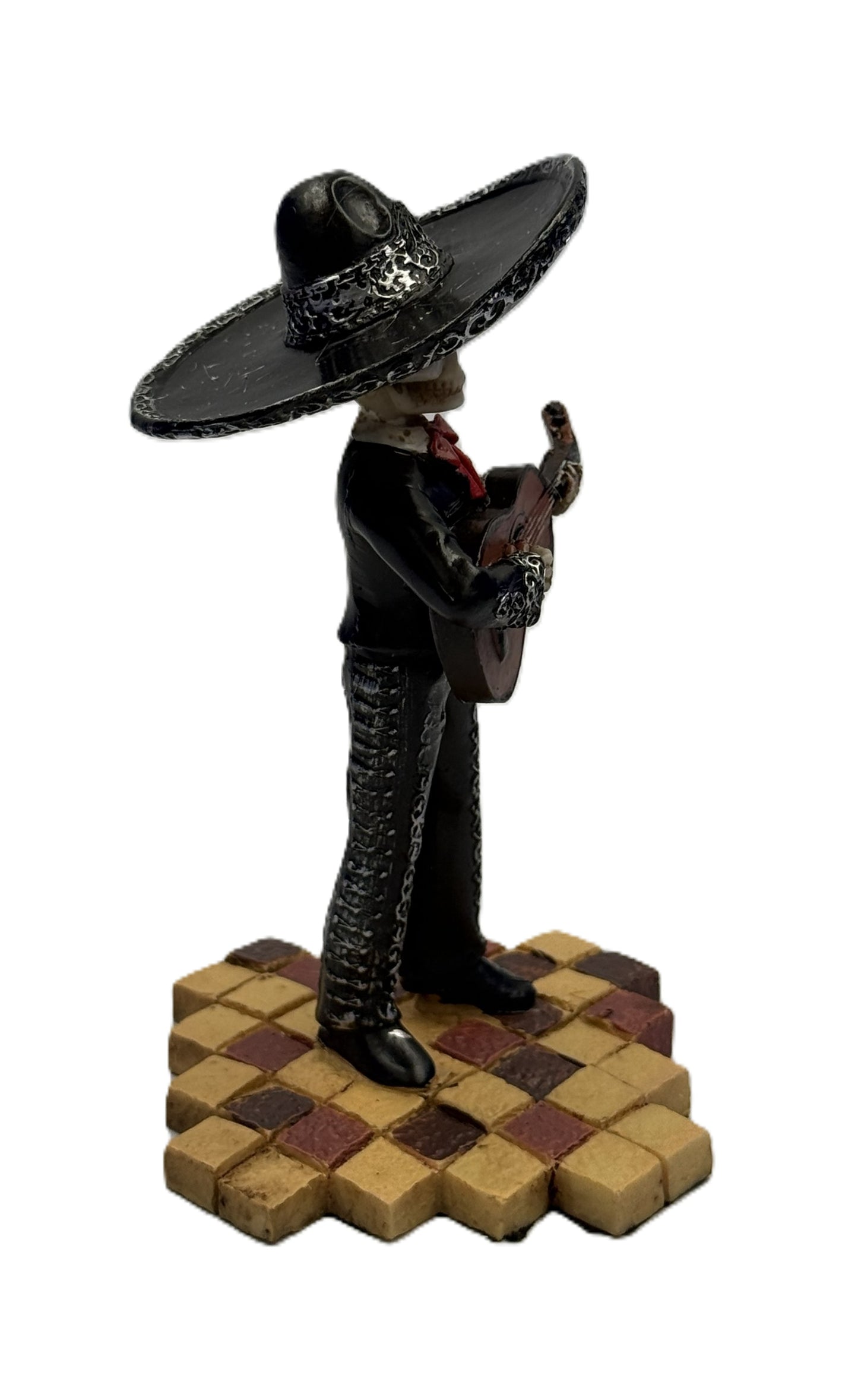 Angled view of Day of the Dead skeleton guitarist statue showing intricate detailing and pose
