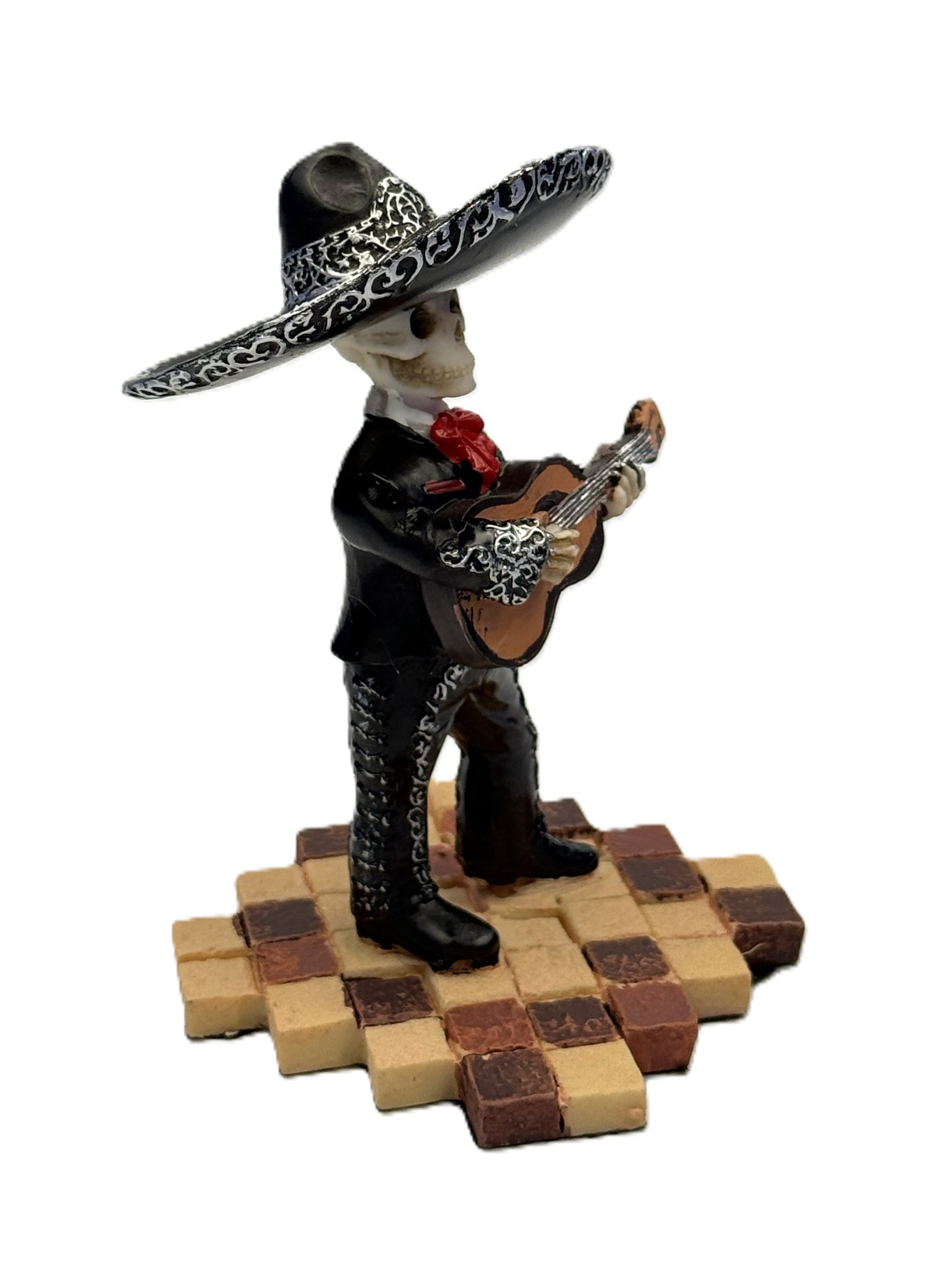 Angled view of Day of the Dead skeleton guitarist statue showing intricate detailing and pose cold cast resin
