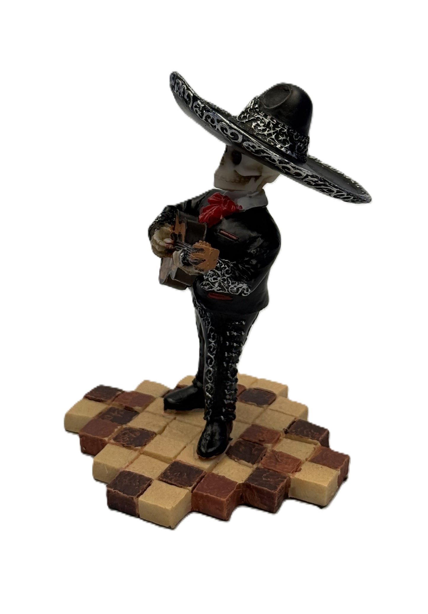Side view of skeleton mariachi guitarist figurine with detailed black outfit and sombrero cold cast resin
