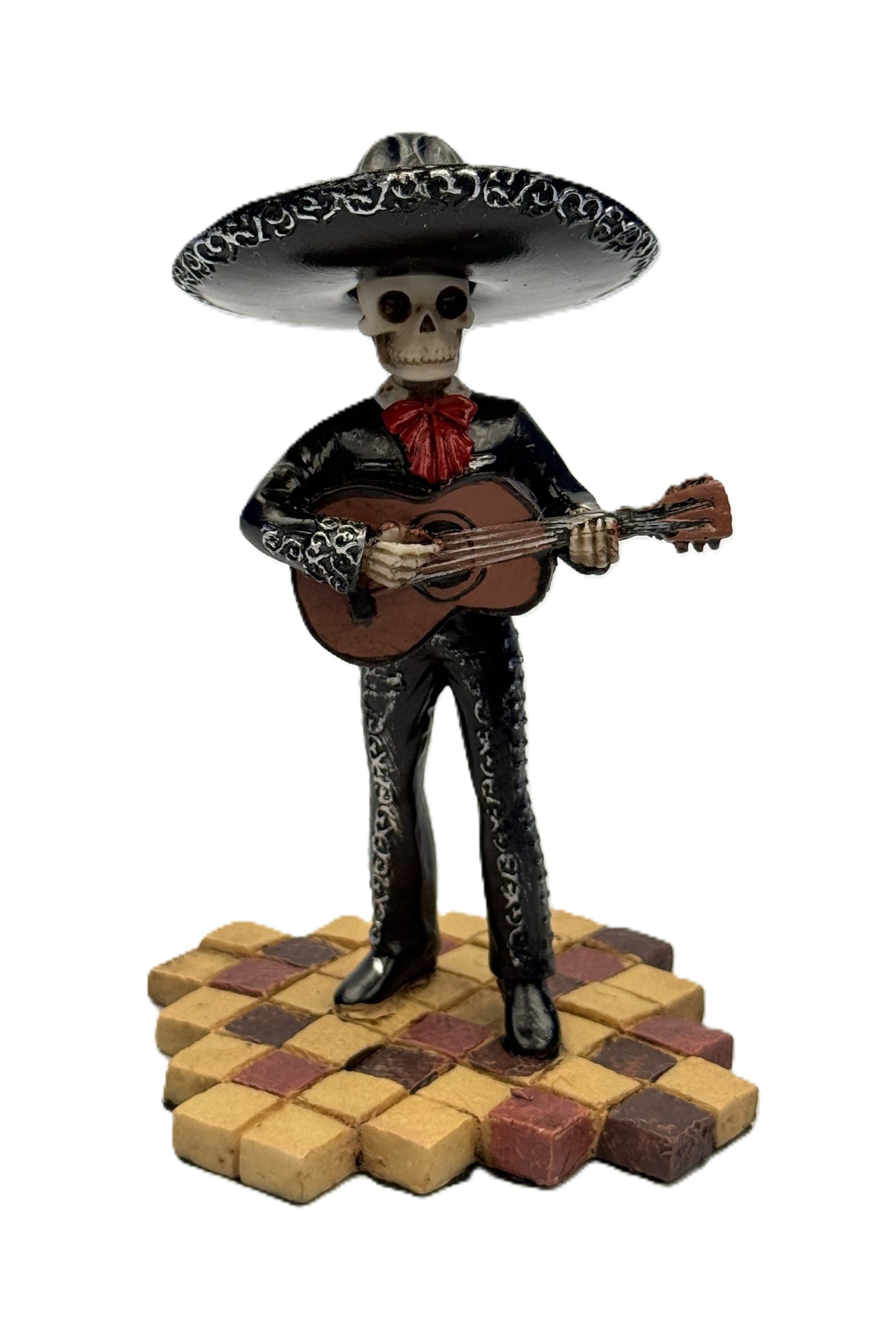 Front view of Day of the Dead mariachi skeleton figurine playing guitar with black outfit and sombrero
