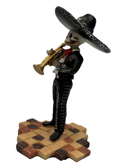 Side view of skeleton mariachi trumpet player figurine with detailed black outfit and sombrero cold cast resin
