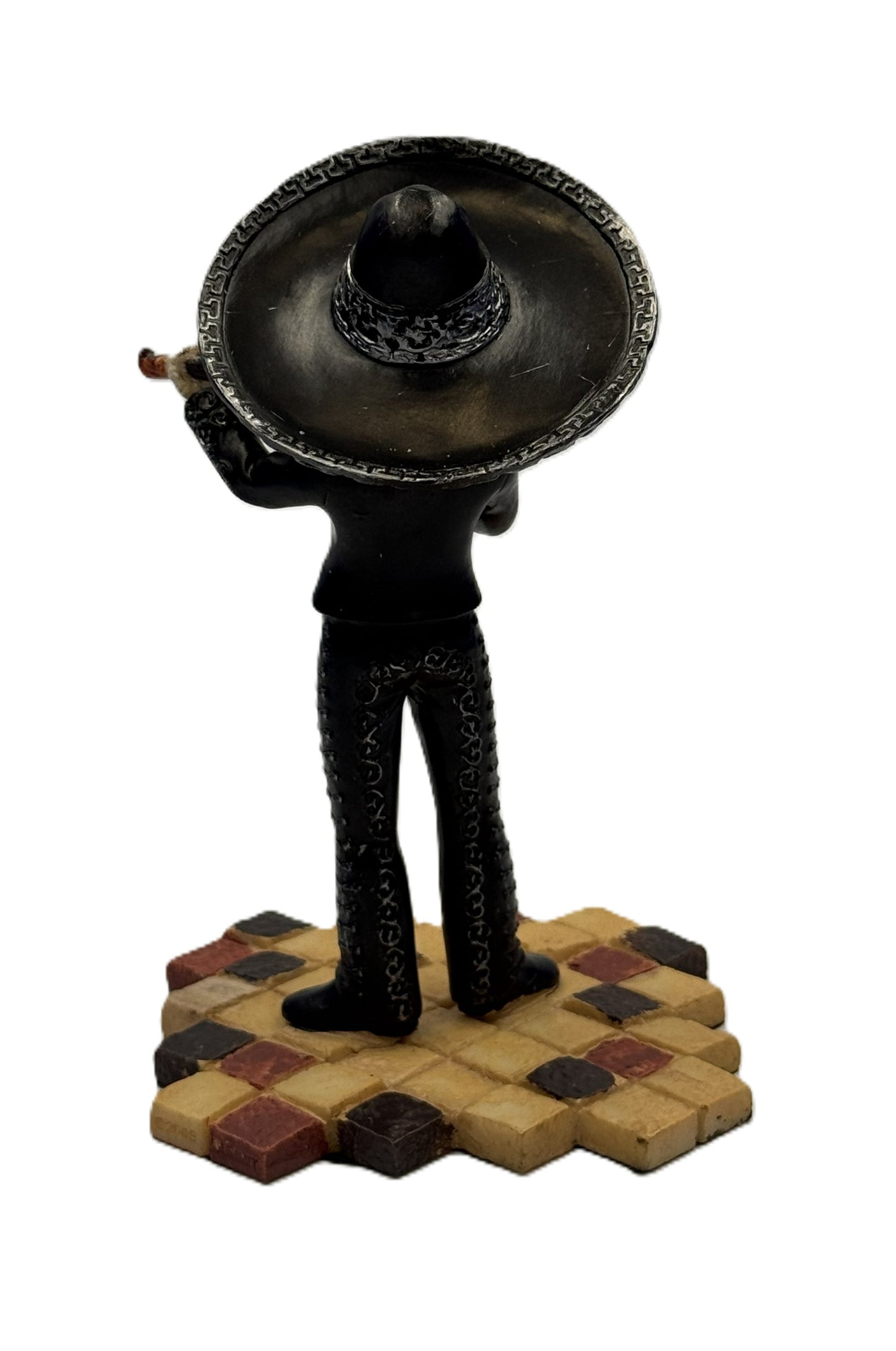 Back view of mariachi skeleton figurine highlighting sombrero and black suit details
