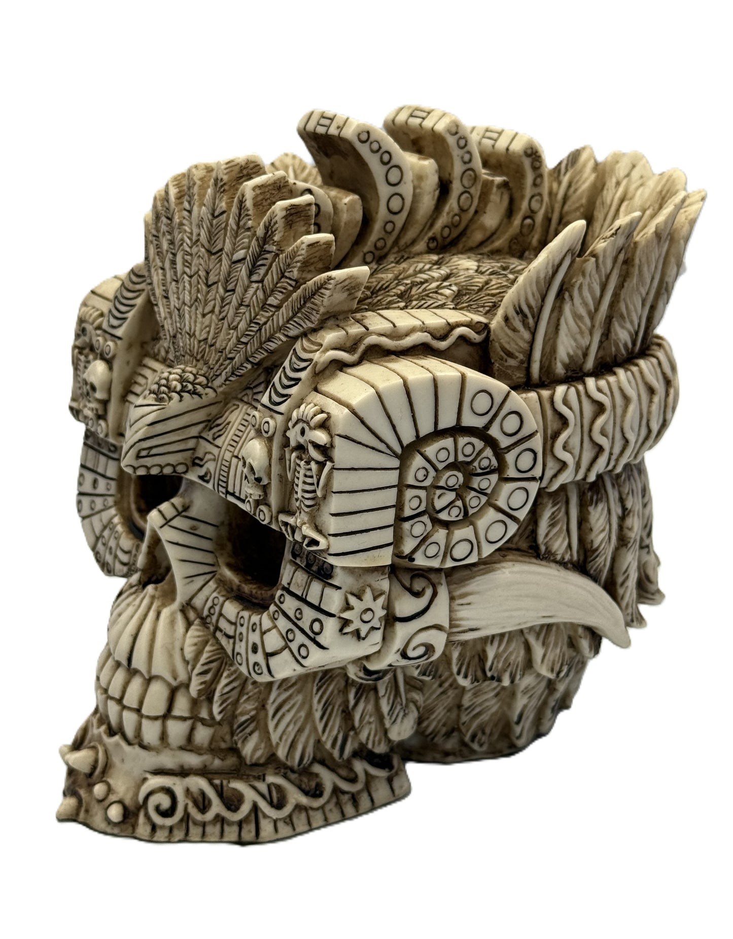 Side front view of Aztec skull decor featuring detailed headdress layers and geometric tribal patterns
