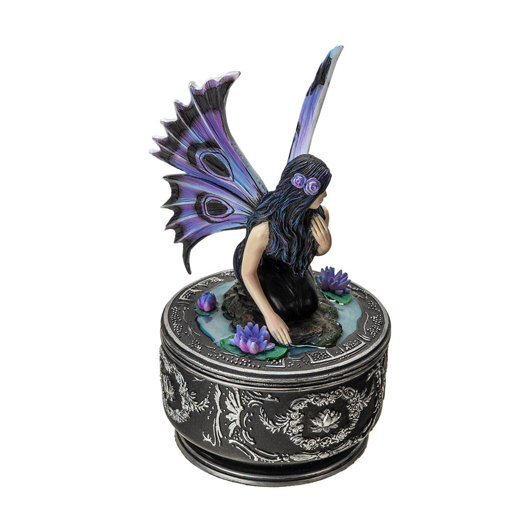 Angled view of fairy trinket box with lotus flowers and decorative base

