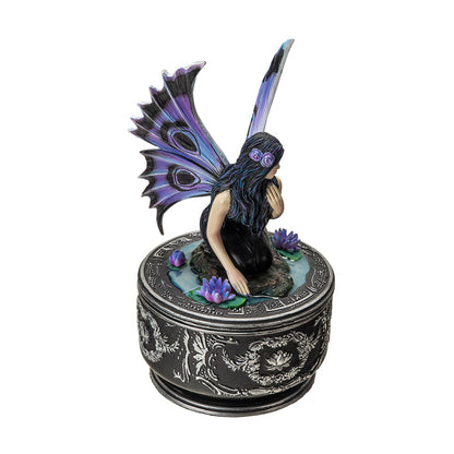 Angled view of fairy trinket box with lotus flowers and decorative base
