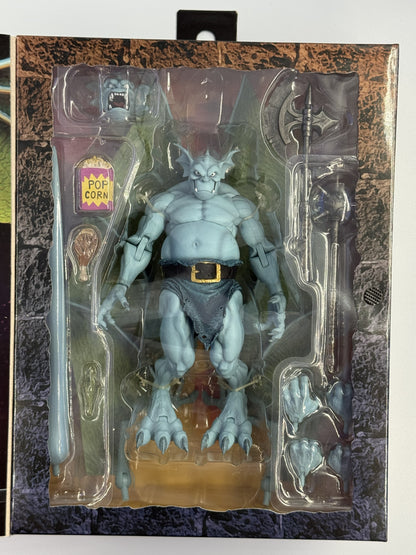 NECA Gargoyles Broadway figure inside packaging with accessories and interchangeable parts
