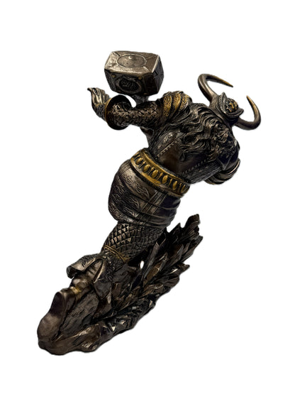 Rear angle view of Norse warrior statue highlighting armor texture and hammer position
