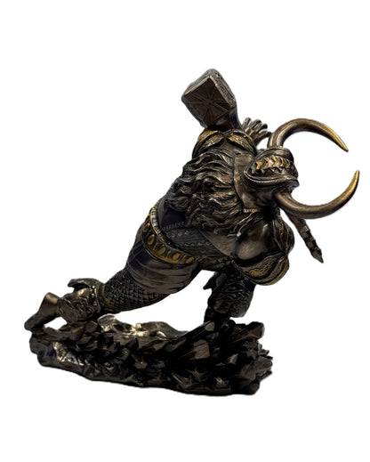 Side view of Viking warrior figurine mid-swing with hammer and detailed sculpting

