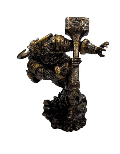 Top angle view of Norse warrior statue showing hammer detail and helmet horns
