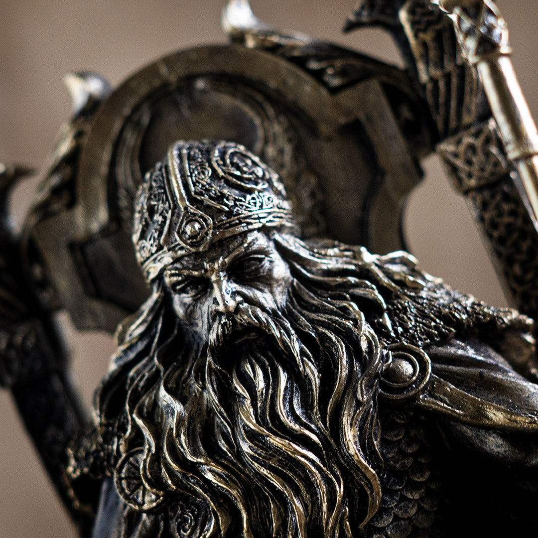 Close-up of Odin the Allfather face and beard with intricate bronze detailing
