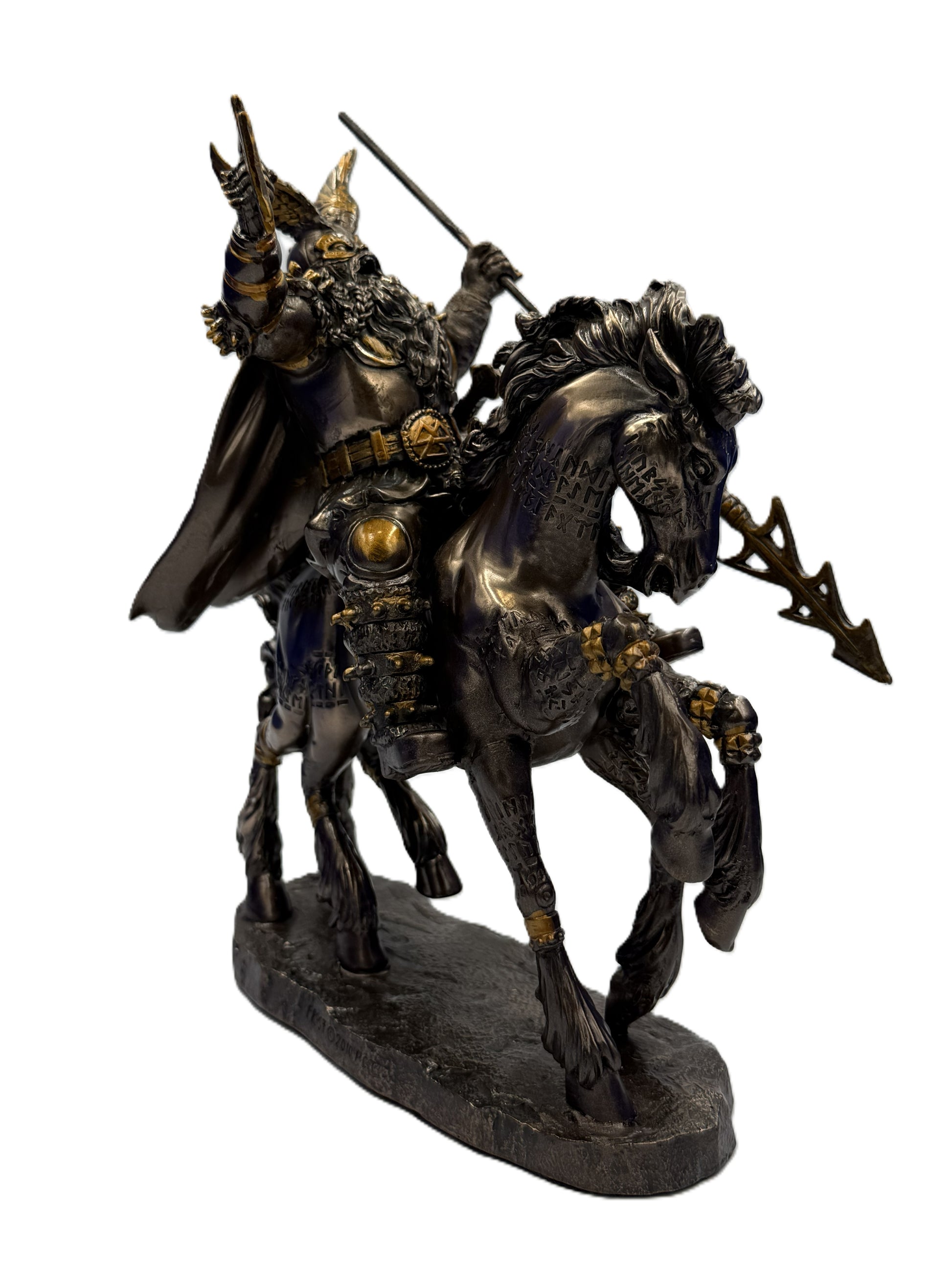 Front right view of Odin statue with spear raised riding horse with Norse engravings

