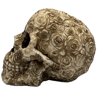 Left side view of floral skull decor showing layered rose patterns and textured resin surface
