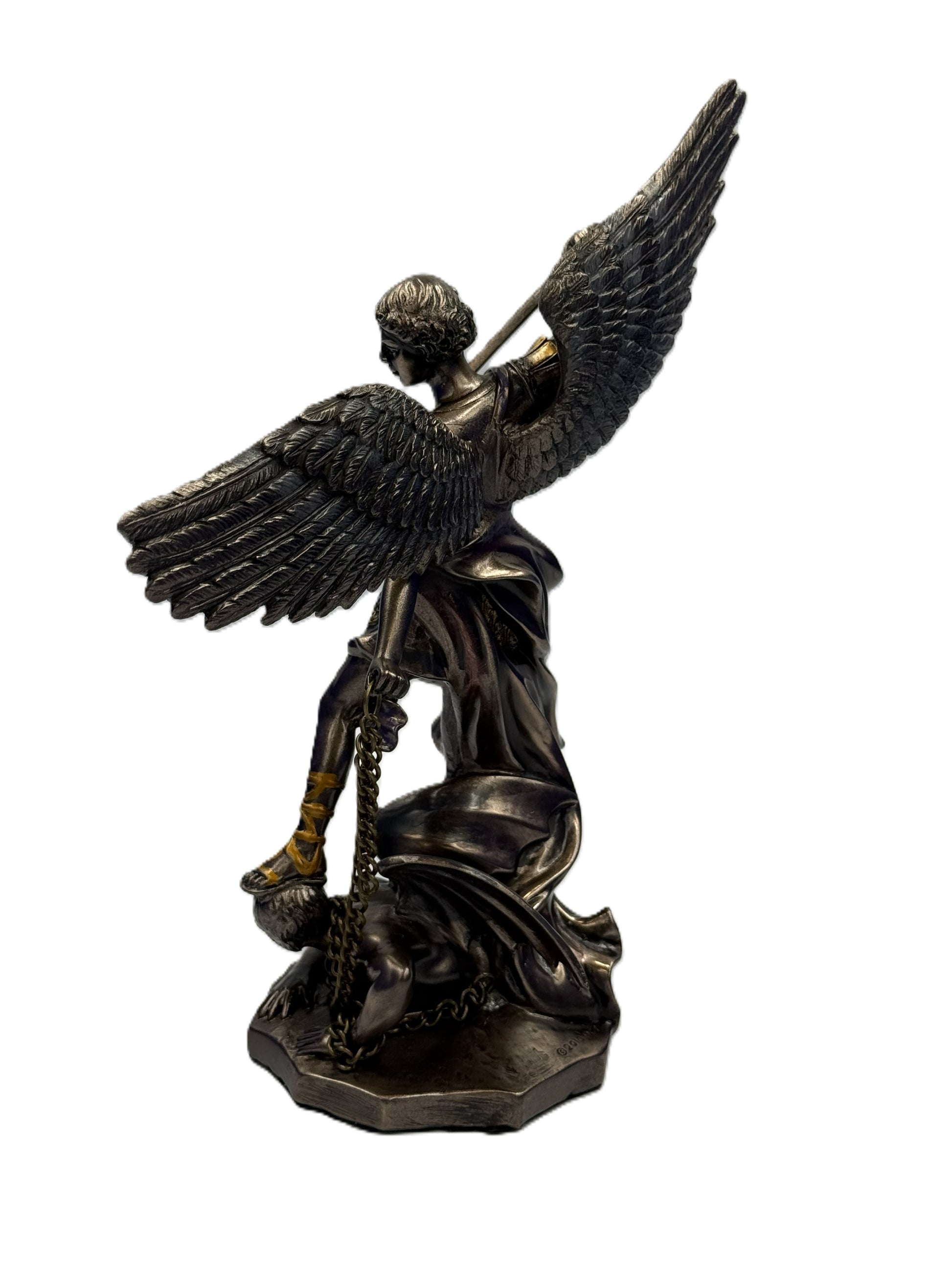Side view of Saint Michael statue highlighting flowing robe and chained demon figure
