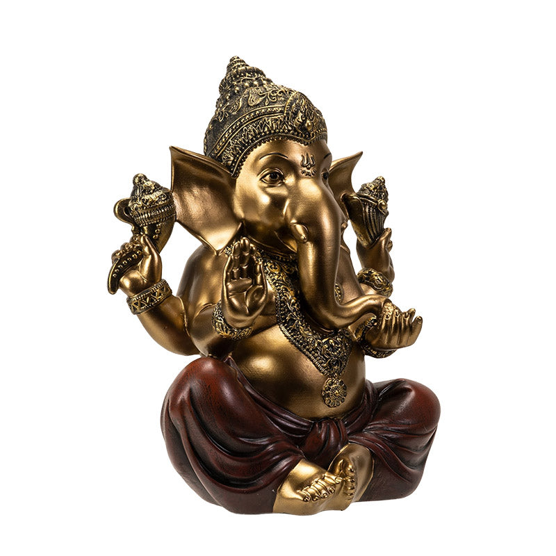 Angled view of seated Ganesha statue highlighting intricate details and gold finish
