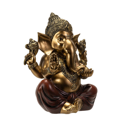 Angled view of seated Ganesha statue highlighting intricate details and gold finish
