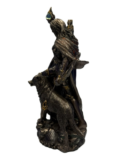 Side view of Skadi statue showing flowing cloak, bow detail, and wolf figure beside her
