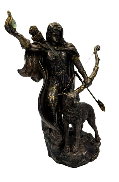 Side view of Skadi statue showing flowing cloak, bow detail, and wolf figure beside her

