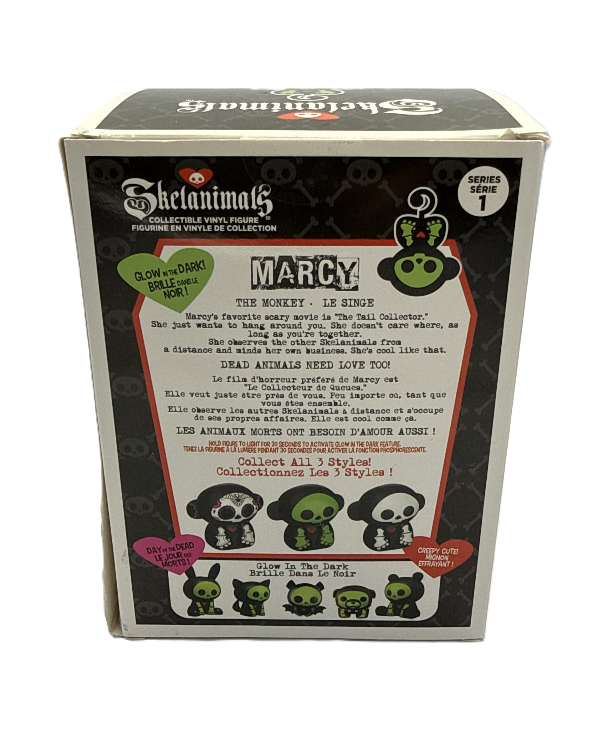 Back of Skelanimals Marcy vinyl figure packaging showing character artwork description and series lineup
