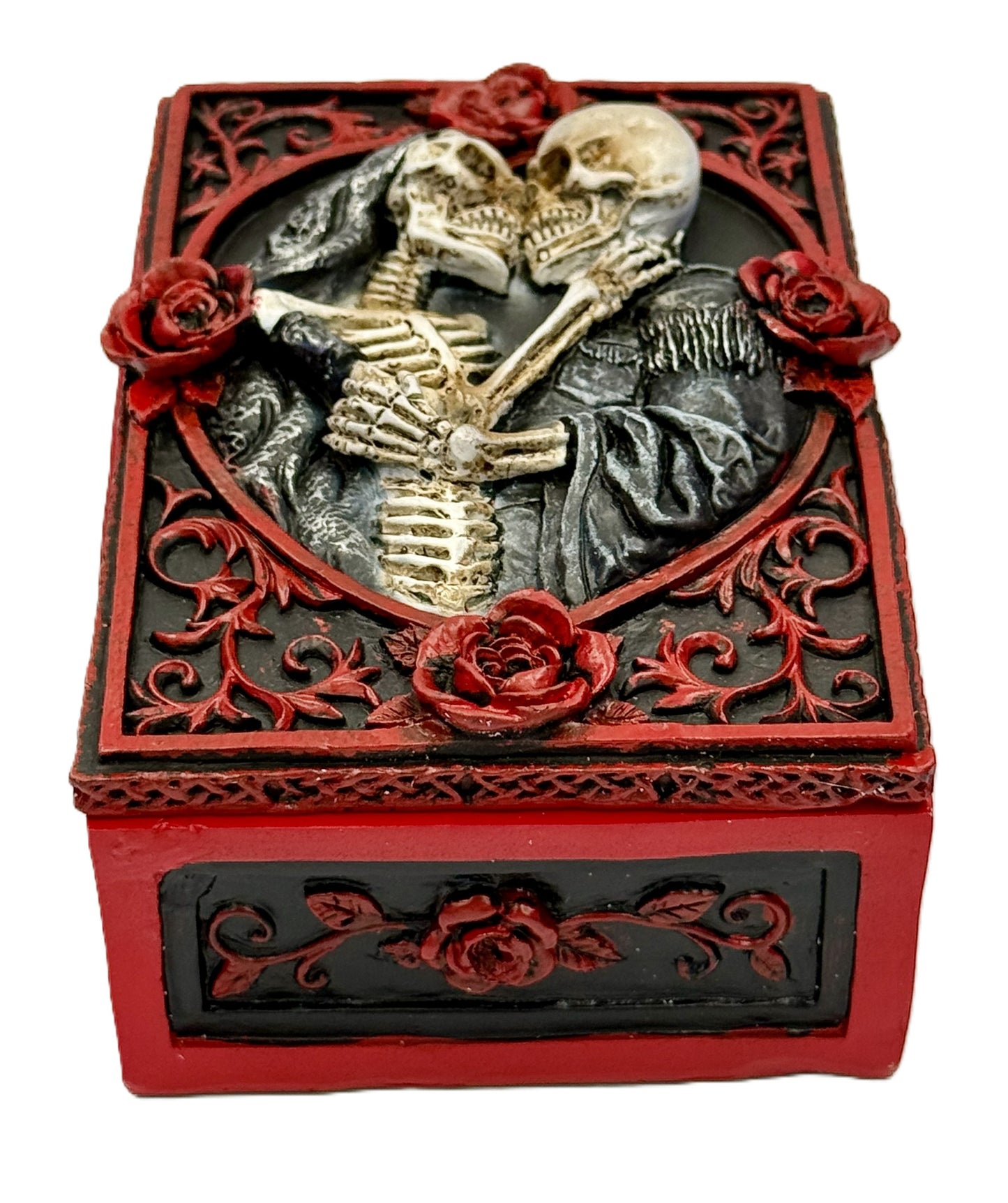 Front view of skeleton couple embracing inside heart frame with red roses
