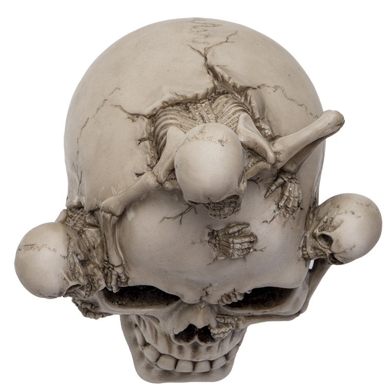 Top view highlighting skeleton emerging from skull with intricate sculpting details
